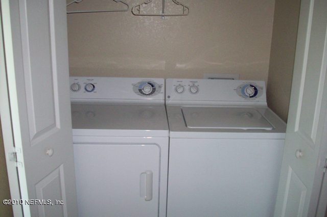 9745 Touchton Road, Unit 1701 Jacksonville, FL 32246 - Photo 12 of 12 a utility room with dryer and washer
