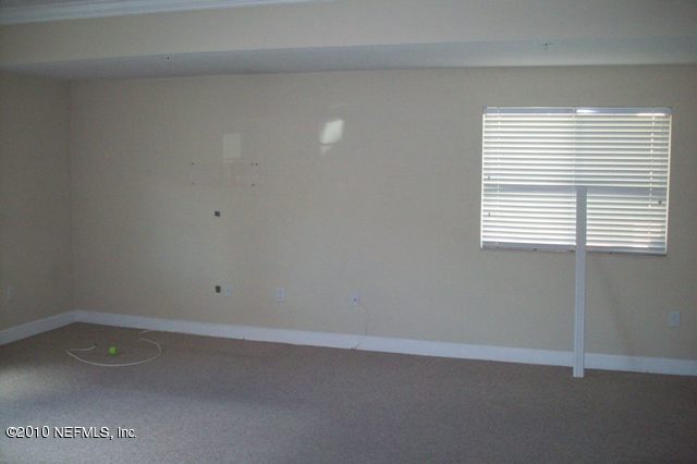 9745 Touchton Road, Unit 1701 Jacksonville, FL 32246 - Photo 5 of 12 a room that has a window in it