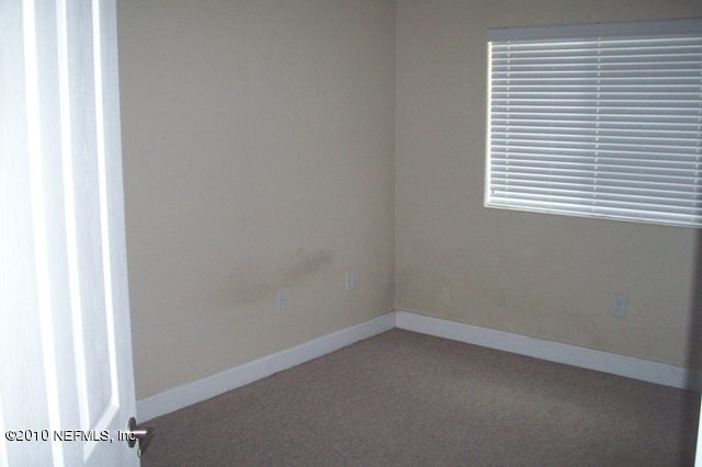9745 Touchton Road, Unit 1701 Jacksonville, FL 32246 - Photo 9 of 12 an empty room with a window