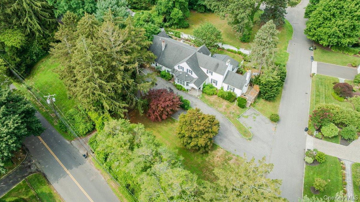 an aerial view of residential house with green space