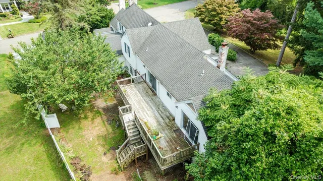 an aerial view of a residential houses with outdoor space