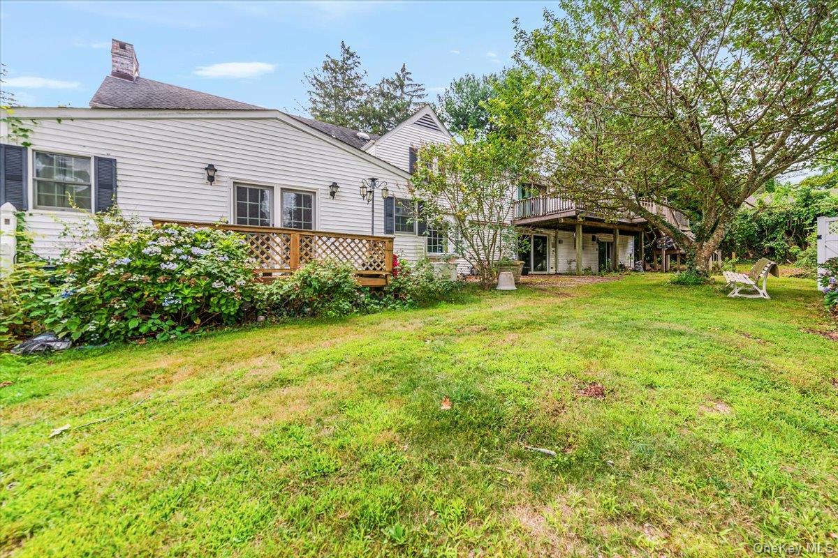 221 Huntington Bay Road Huntington, NY 11743 - Photo 15 of 23 front view of a house with a big yard