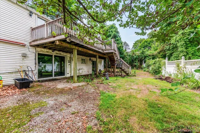 a view of a house with yard and sitting area