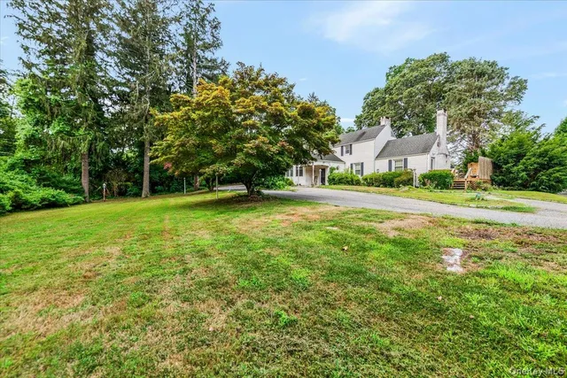 a view of a field of grass and trees