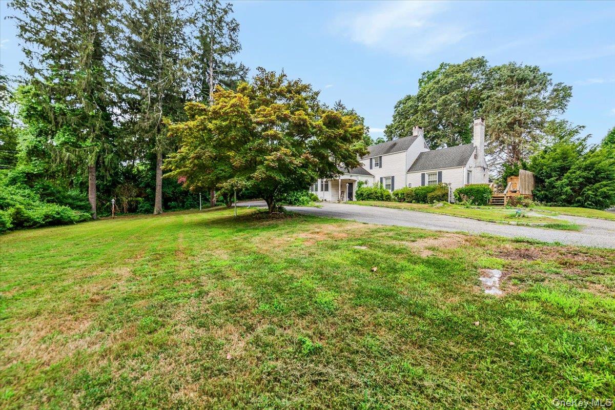 221 Huntington Bay Road Huntington, NY 11743 - Photo 18 of 23 a view of a field of grass and trees