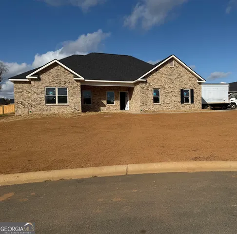 a house with trees in the background