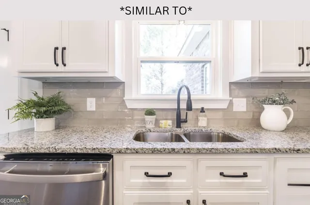 a bathroom with a tub sink and shower