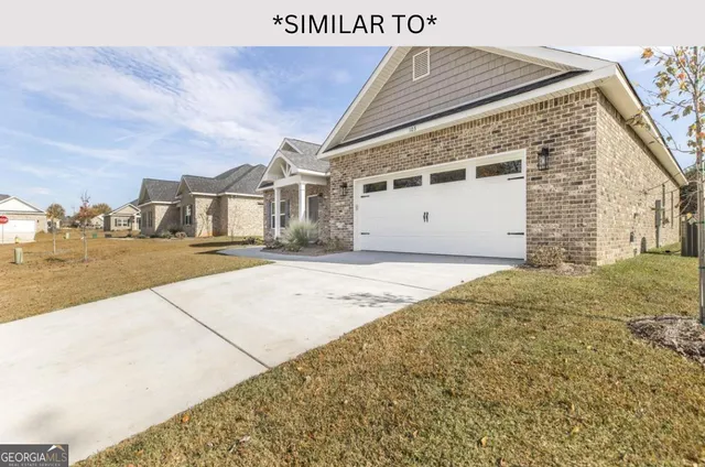 a kitchen with stainless steel appliances granite countertop a stove top oven a sink dishwasher a refrigerator and white cabinets with wooden floor