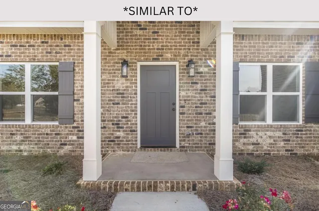 a kitchen with granite countertop a stove and a white sink