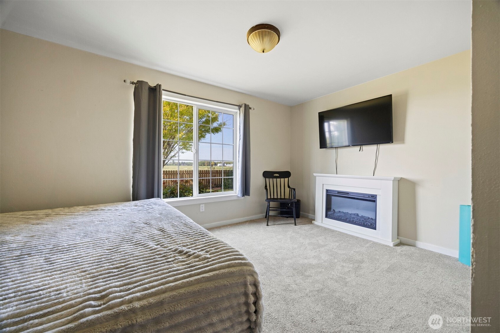 8429 Nooksack Road Everson, WA 98247 - Photo 20 of 38 a bedroom with a bed and a flat screen tv