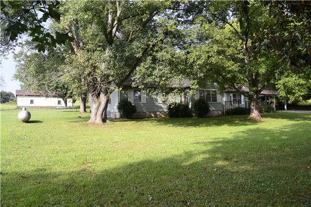 2148 Hill Cemetery Road Lewisburg, TN 37091 - Photo 16 of 19 Side view of home w/ mature trees and storage building.