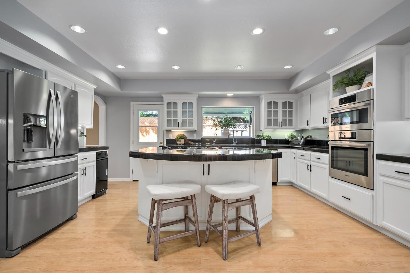 1629 Cherry Avenue San Jose, CA 95125 - Photo 19 of 61 a kitchen with stainless steel appliances kitchen island granite countertop a stove and cabinets