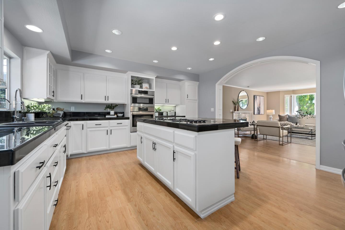 1629 Cherry Avenue San Jose, CA 95125 - Photo 20 of 61 an open white kitchen with center island and a stove top oven