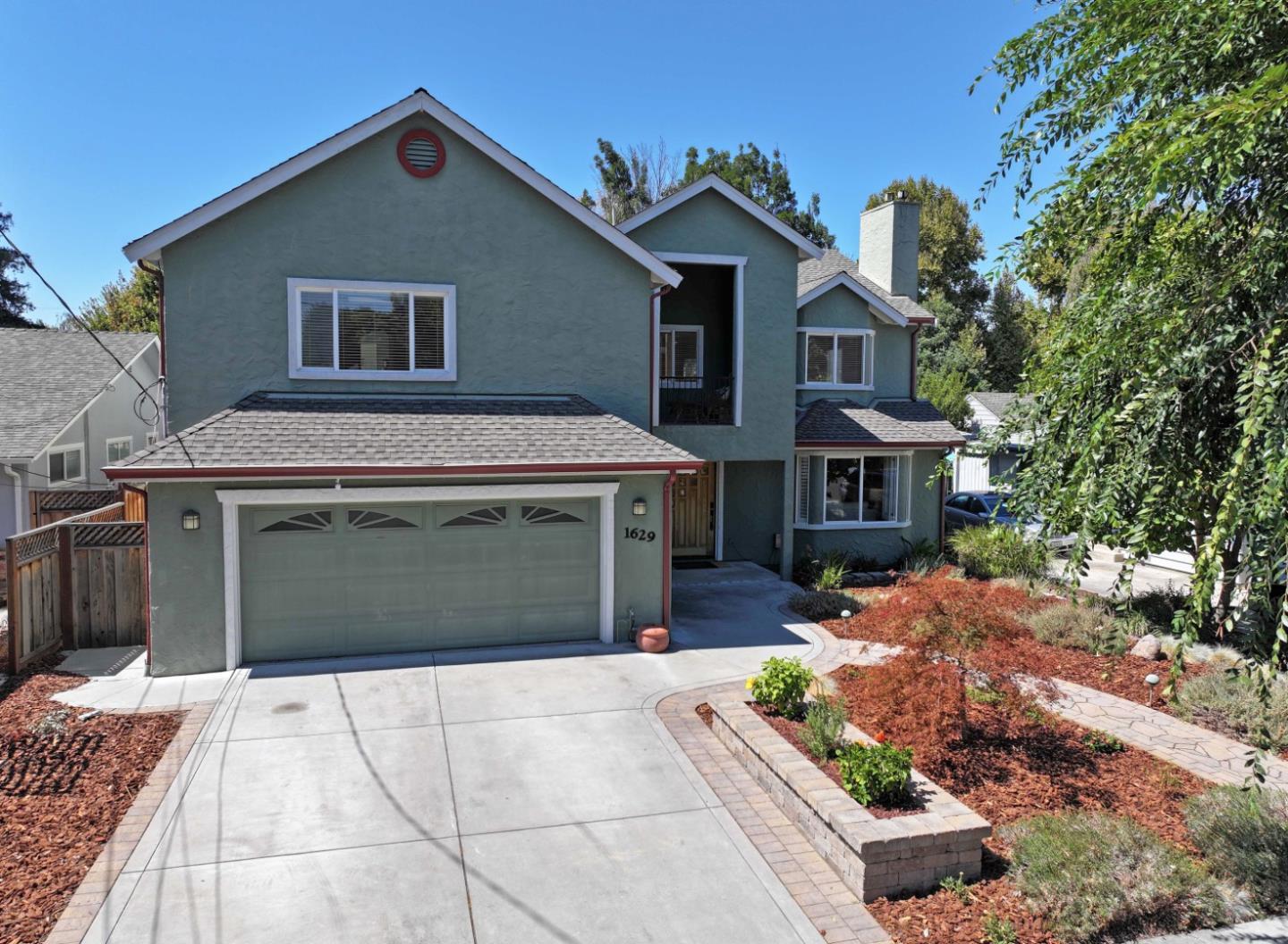 1629 Cherry Avenue San Jose, CA 95125 - Photo 49 of 61 a front view of a house with a yard and garage