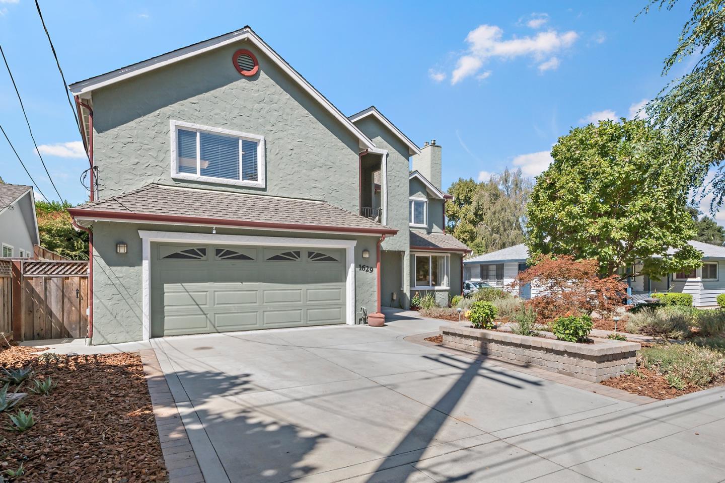 1629 Cherry Avenue San Jose, CA 95125 - Photo 9 of 61 a front view of a house with a yard