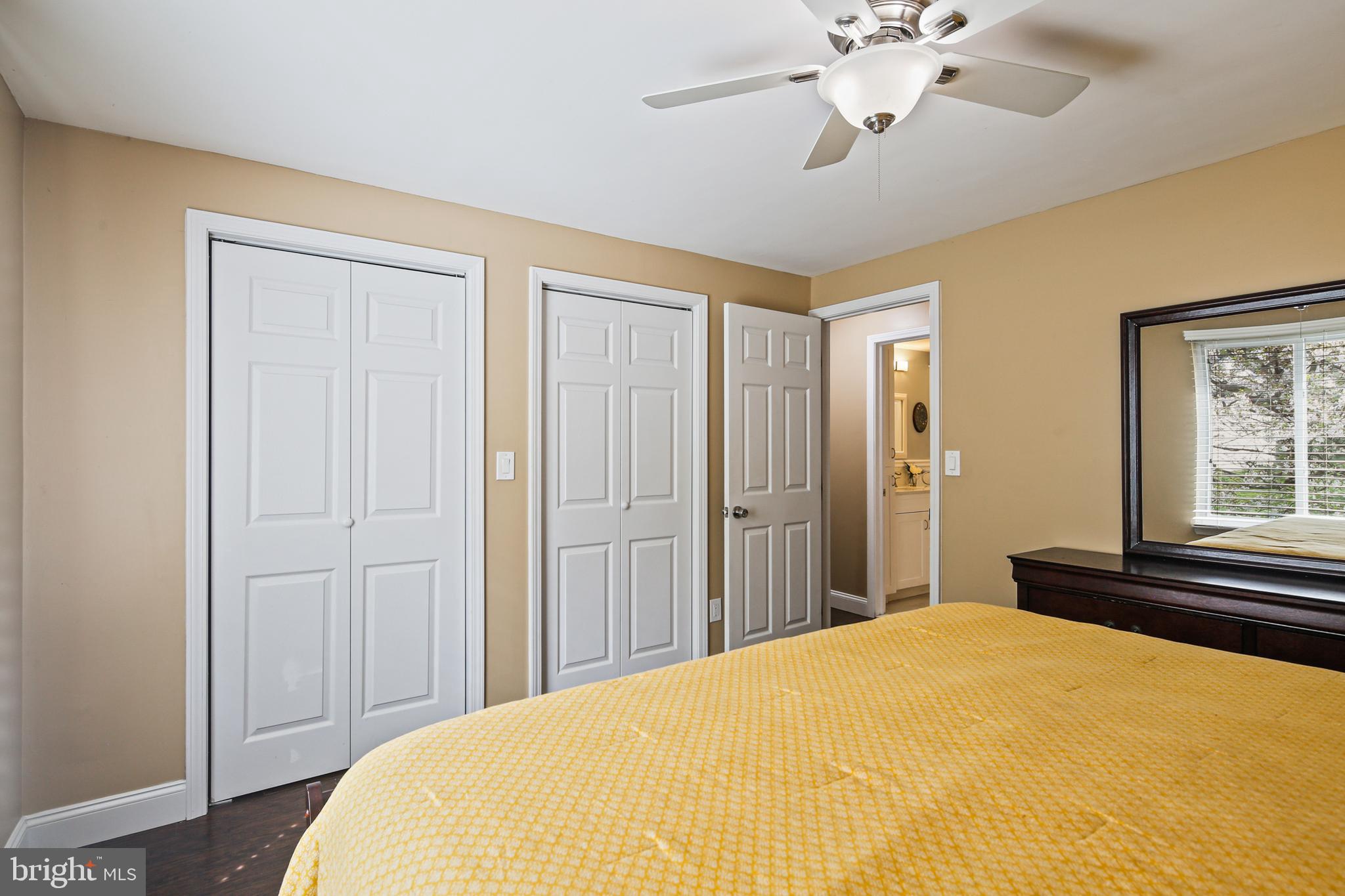 9348 Northgate Road Laurel, MD 20723 - Photo 15 of 42 a bedroom with a bed and a chandelier