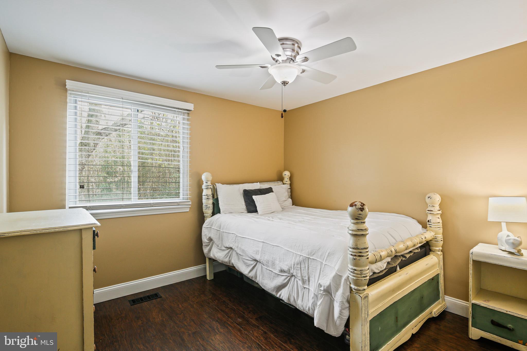 9348 Northgate Road Laurel, MD 20723 - Photo 19 of 42 a bedroom with a bed and a window