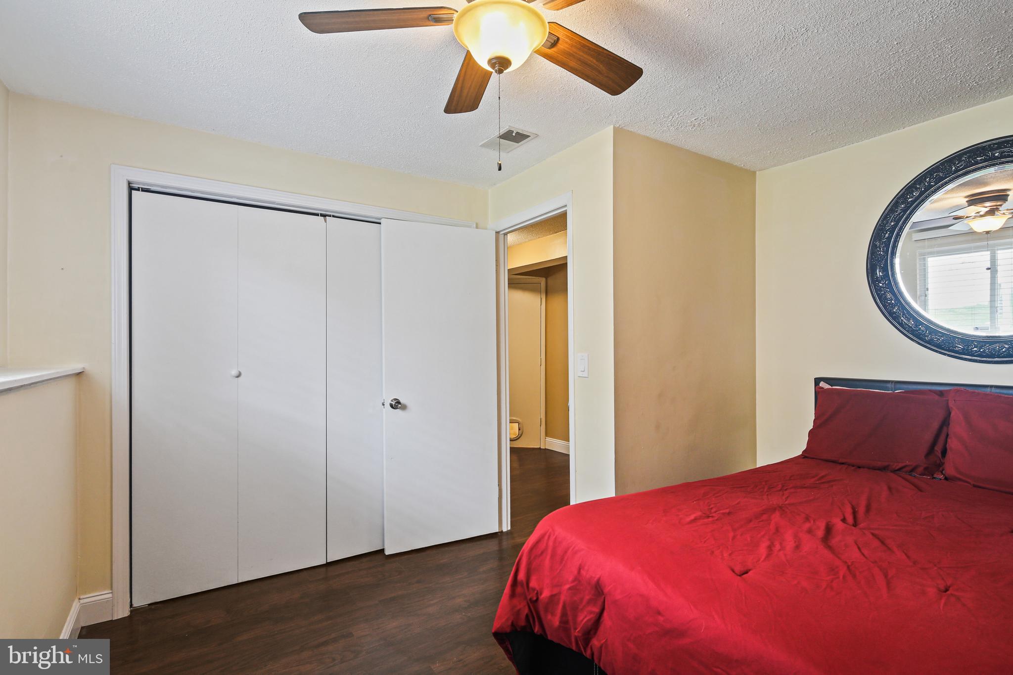 9348 Northgate Road Laurel, MD 20723 - Photo 23 of 42 a bedroom with a bed and a chandelier