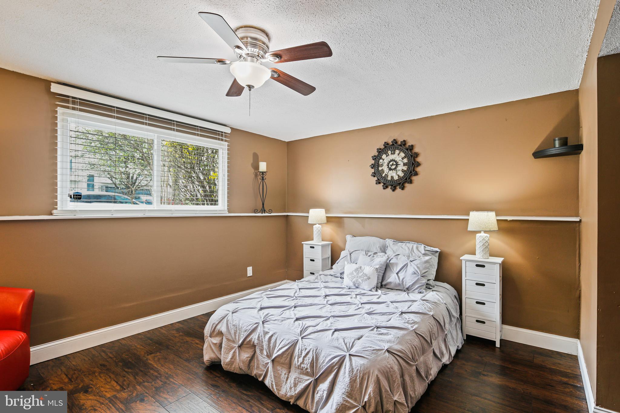 9348 Northgate Road Laurel, MD 20723 - Photo 24 of 42 a bedroom with a bed and wooden floor