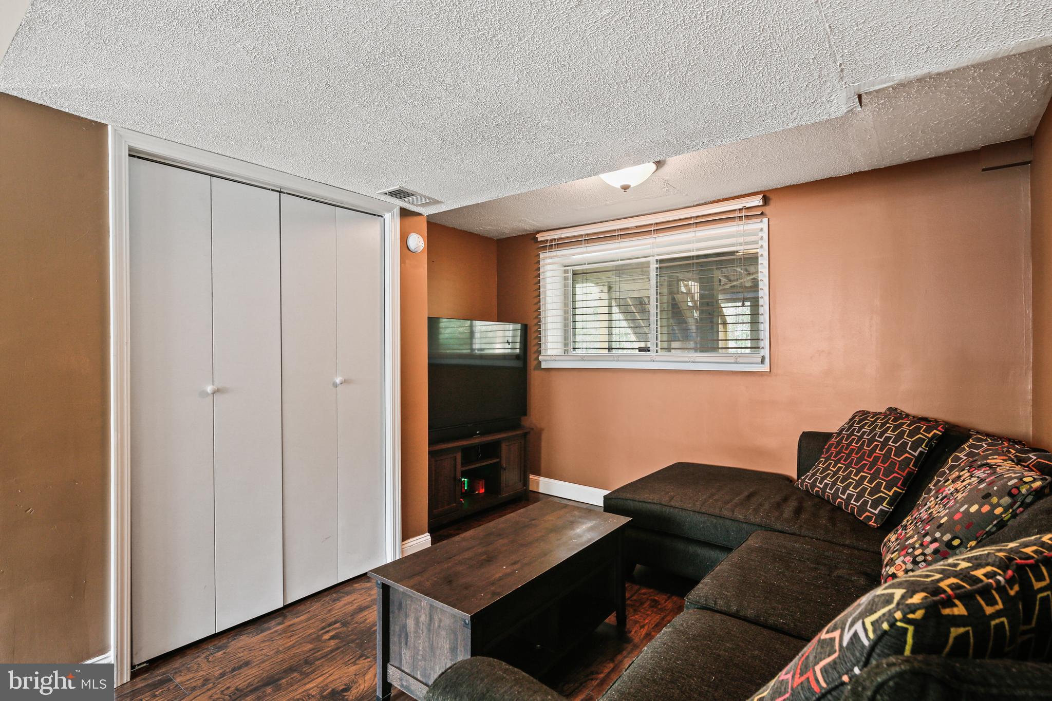 9348 Northgate Road Laurel, MD 20723 - Photo 27 of 42 a living room with furniture and a gate