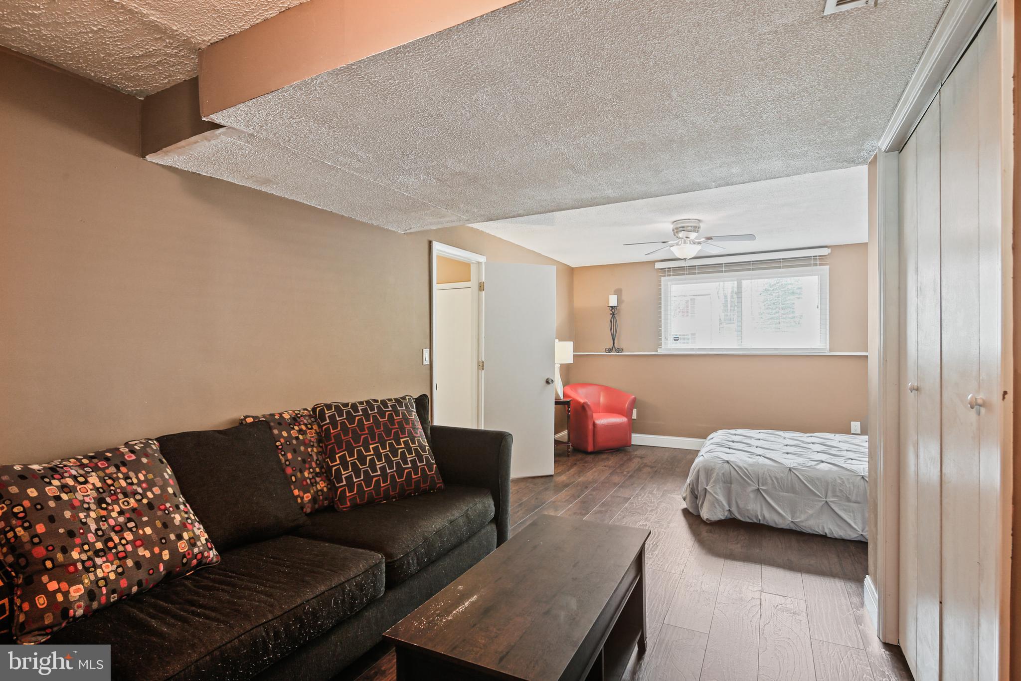 9348 Northgate Road Laurel, MD 20723 - Photo 28 of 42 a bedroom with furniture and a couch