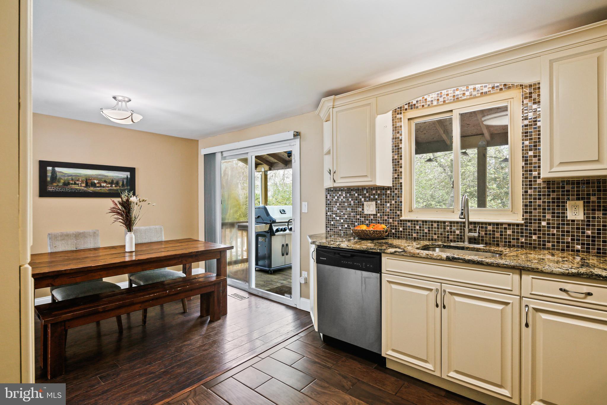 9348 Northgate Road Laurel, MD 20723 - Photo 8 of 42 a kitchen with stainless steel appliances granite countertop a stove and a sink