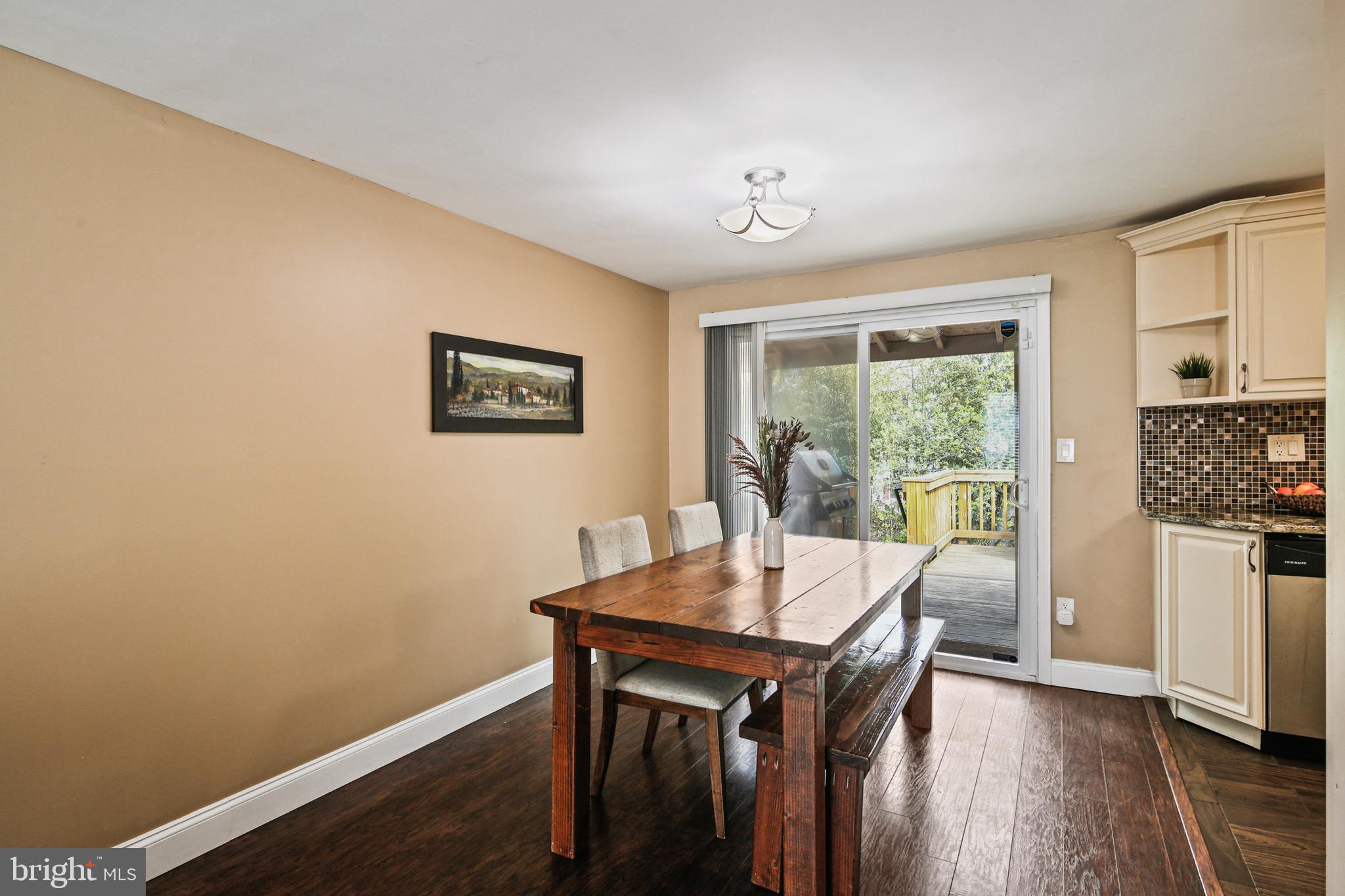 9348 Northgate Road Laurel, MD 20723 - Photo 10 of 42 a view of a dining room with furniture and wooden floor