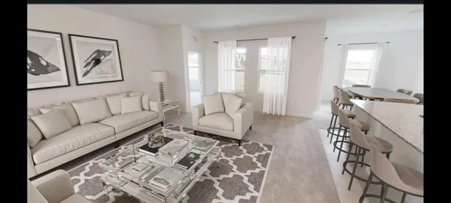 a kitchen with sink cabinets and dining table