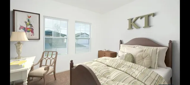 a living room with furniture and a painting on the wall