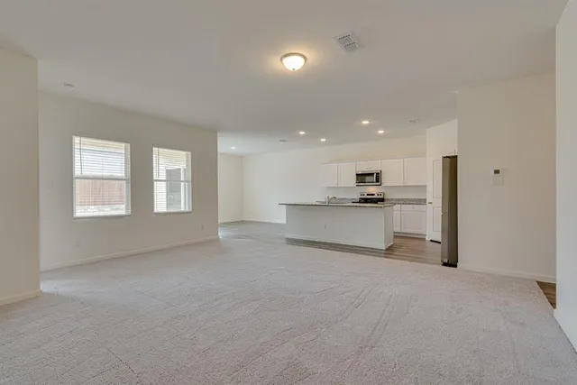 a view of a kitchen with a sink and cabinet