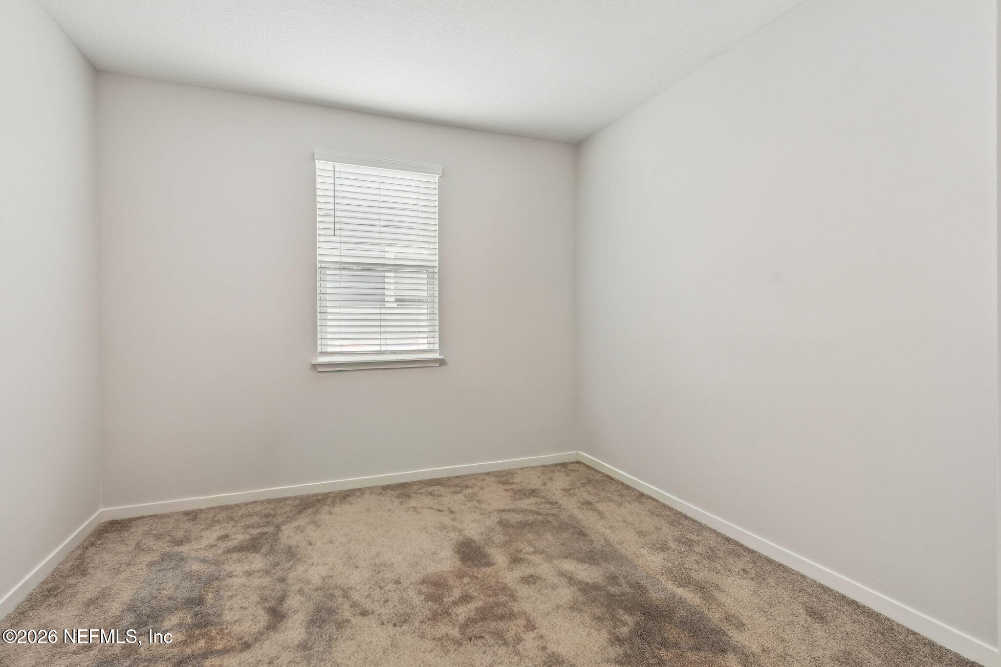 96277 Broadmoore Road Fernandina Beach, FL 32034 - Photo 13 of 31 an empty room with a window