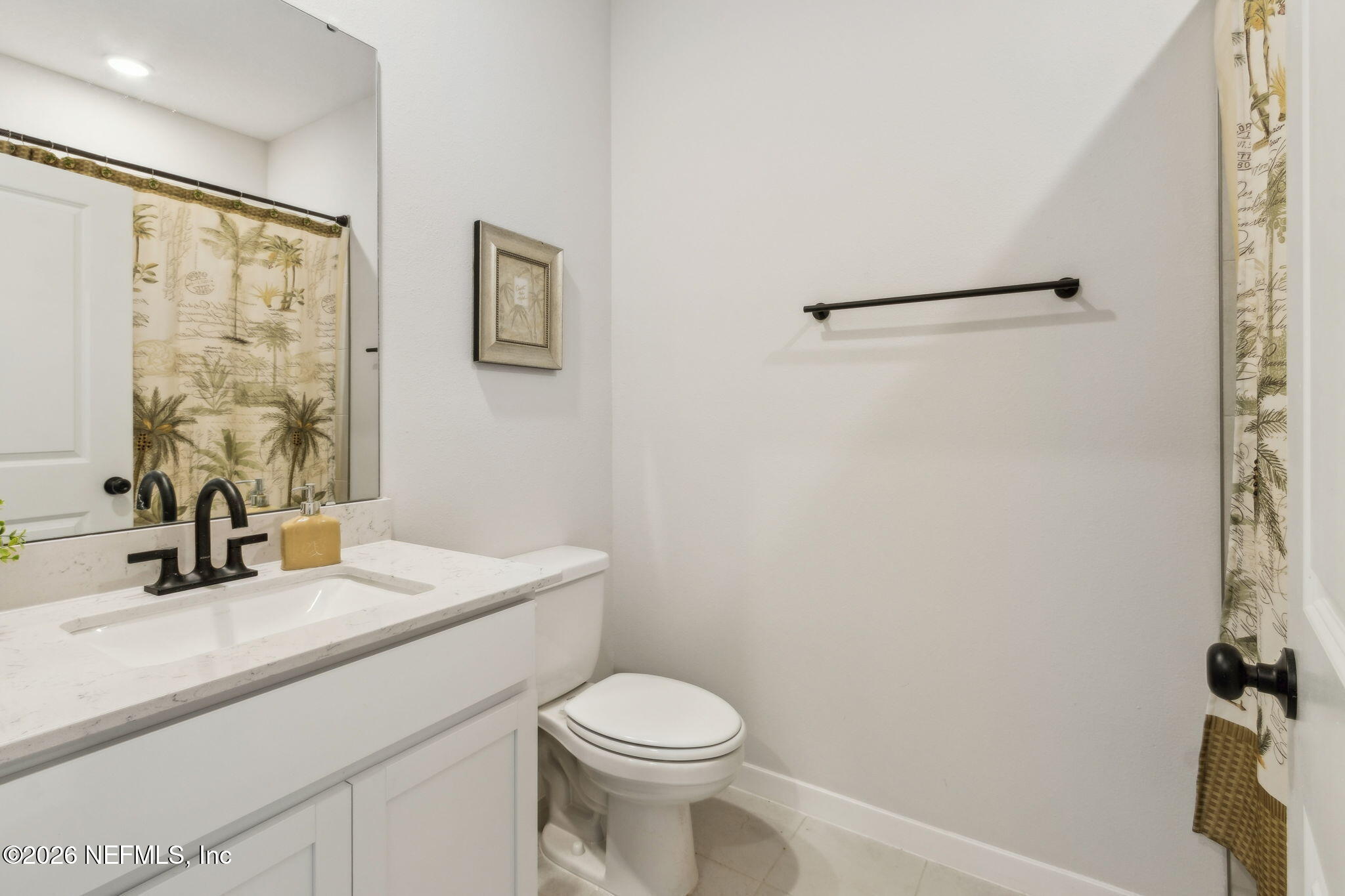96277 Broadmoore Road Fernandina Beach, FL 32034 - Photo 14 of 31 a bathroom with a sink toilet and vanity
