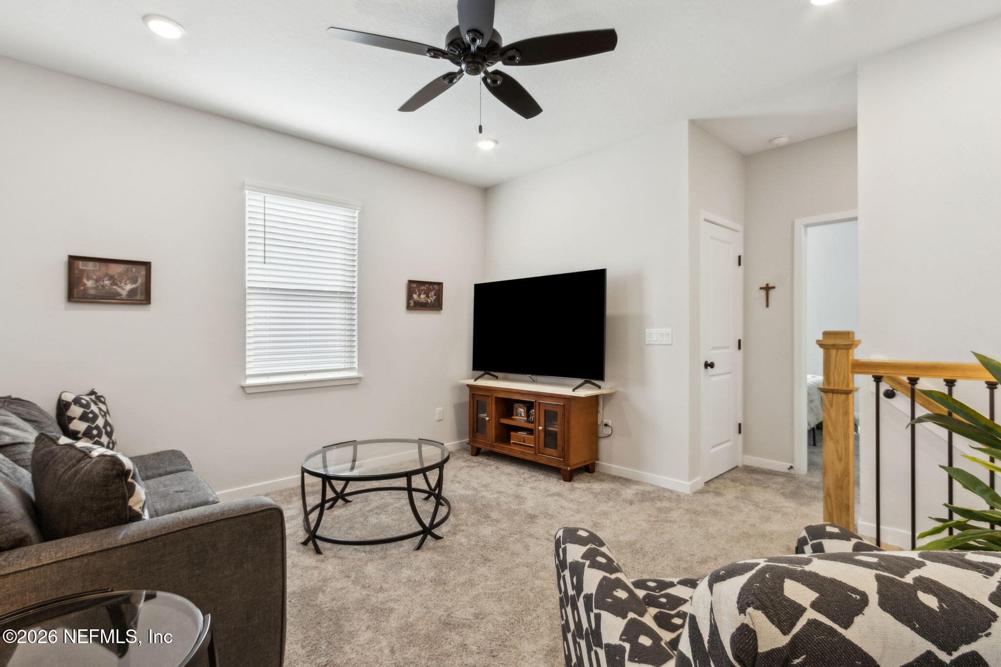 96277 Broadmoore Road Fernandina Beach, FL 32034 - Photo 18 of 31 a living room with furniture and a flat screen tv