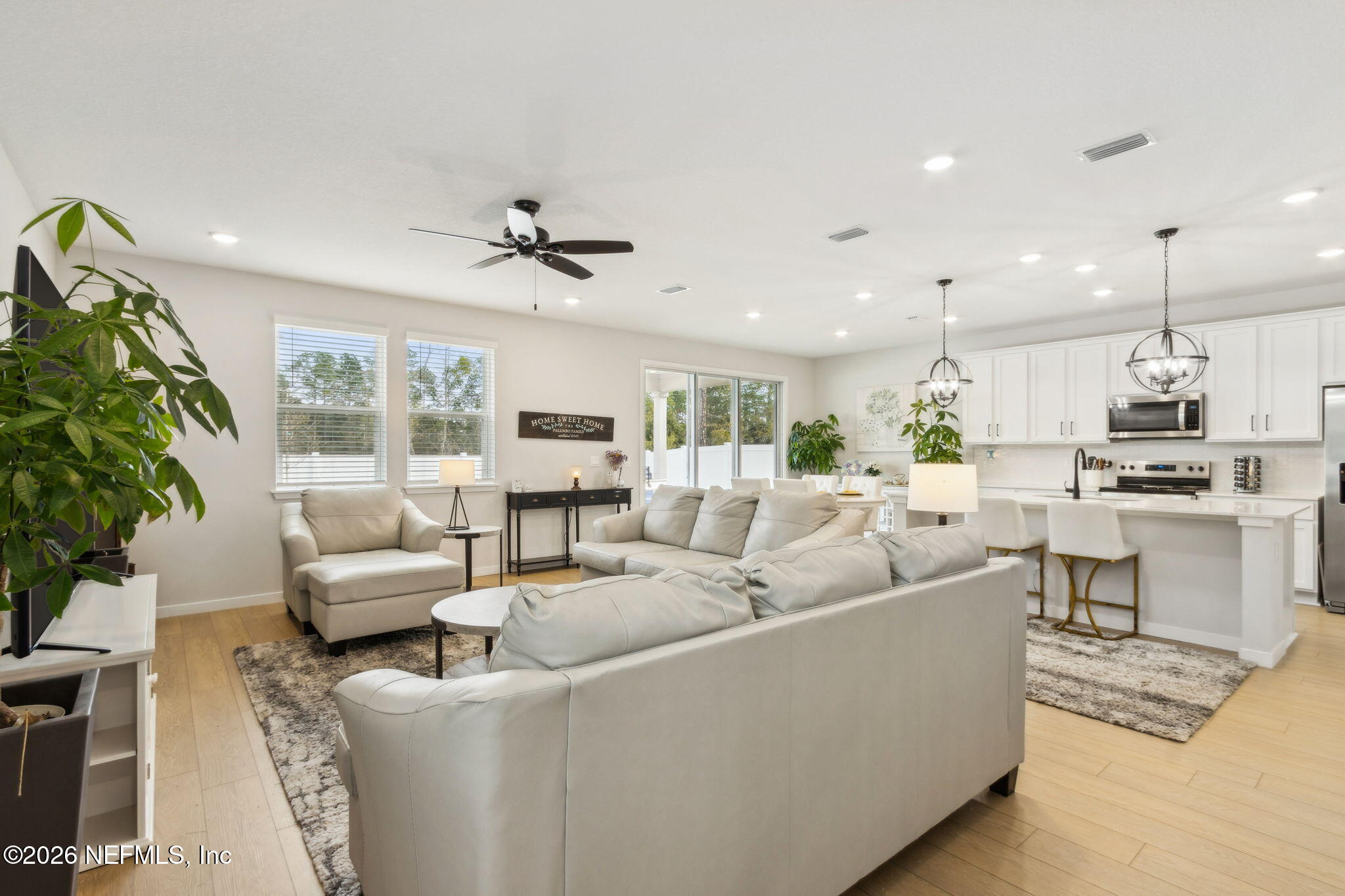 96277 Broadmoore Road Fernandina Beach, FL 32034 - Photo 8 of 31 a living room with furniture and a large window