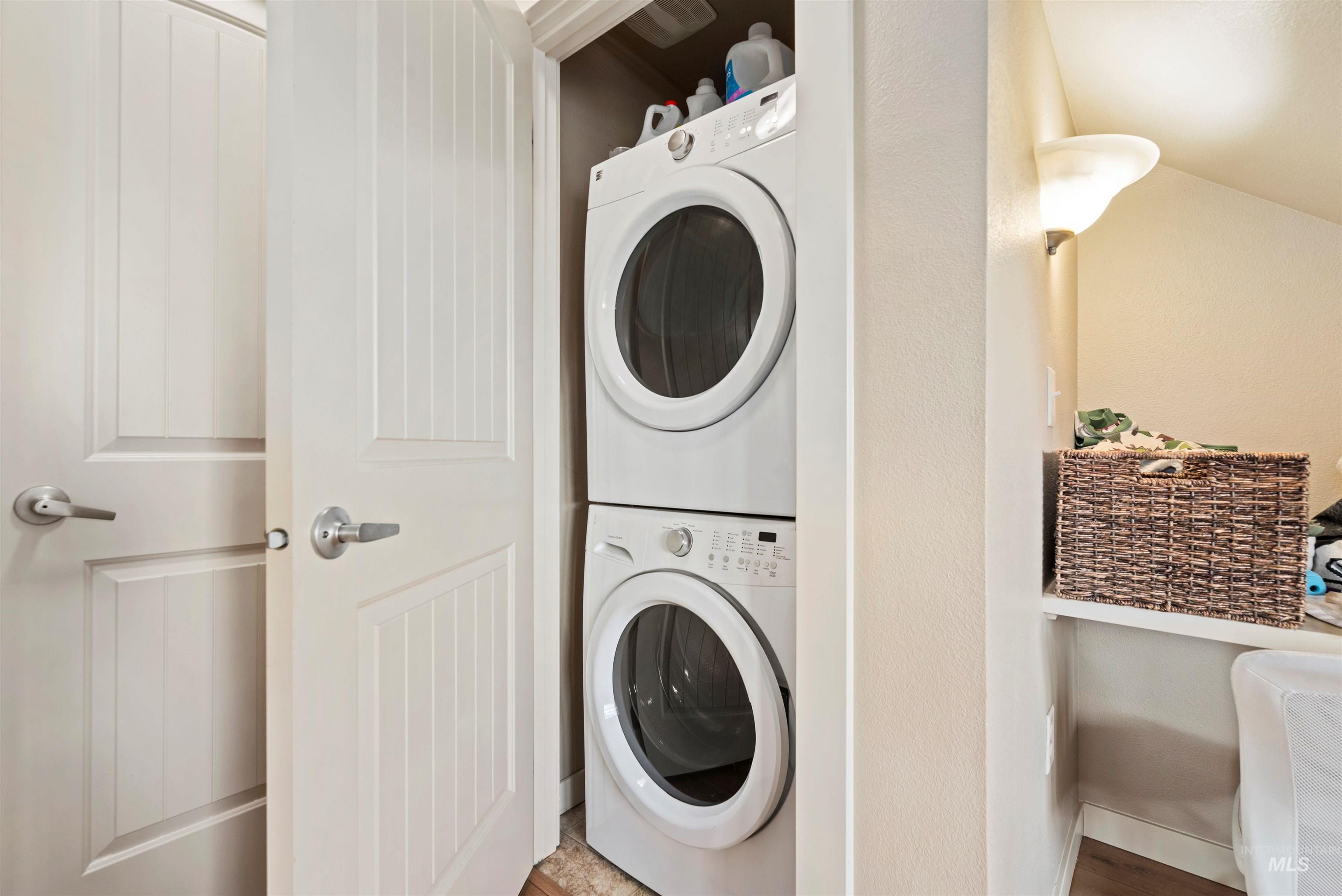 9107 Ustick Road Boise, ID 83704 - Photo 8 of 8 Laundry area with stacked washer and clothes dryer