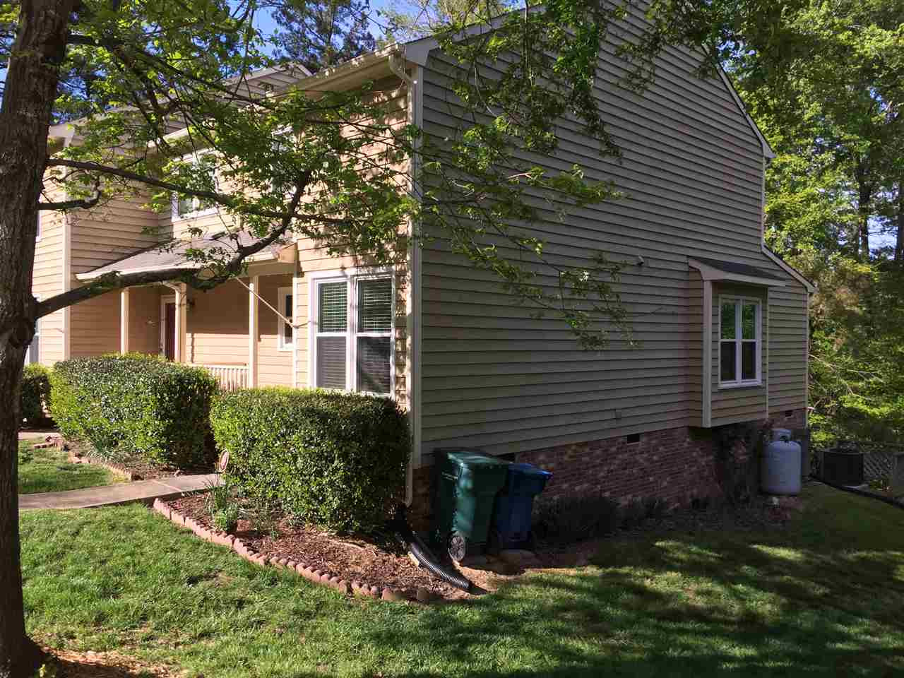 Heritage Woods HOA maintain the exterior of the dwelling: roof, siding, DECK, grounds / landscaping, common areas. There are 2 parking spots for this end unit town home. Dwelling is wired for security system. Side view