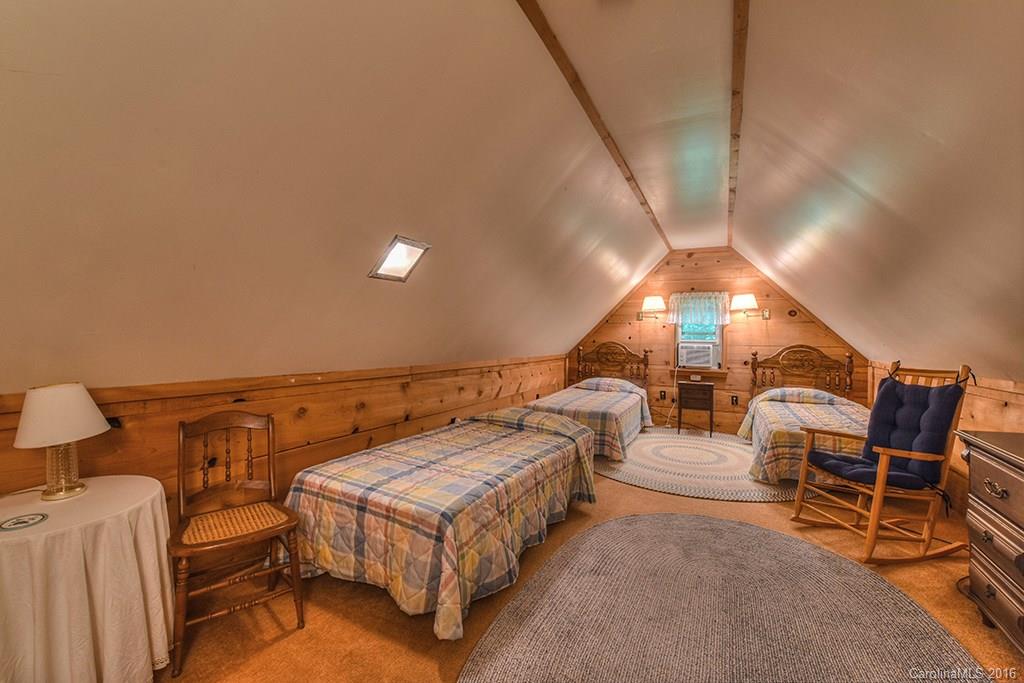 85 Miner Road Waynesville, NC 28785 - Photo 20 of 24 a spacious bedroom with two beds and chairs