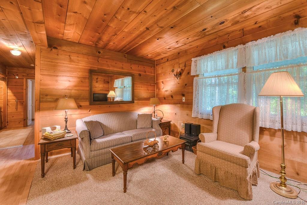 85 Miner Road Waynesville, NC 28785 - Photo 5 of 24 a living room with furniture and a lamp