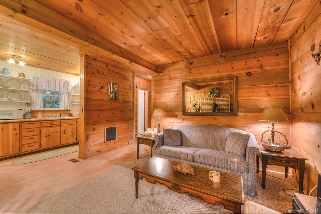 85 Miner Road Waynesville, NC 28785 - Photo 6 of 24 a living room with furniture and wooden floor