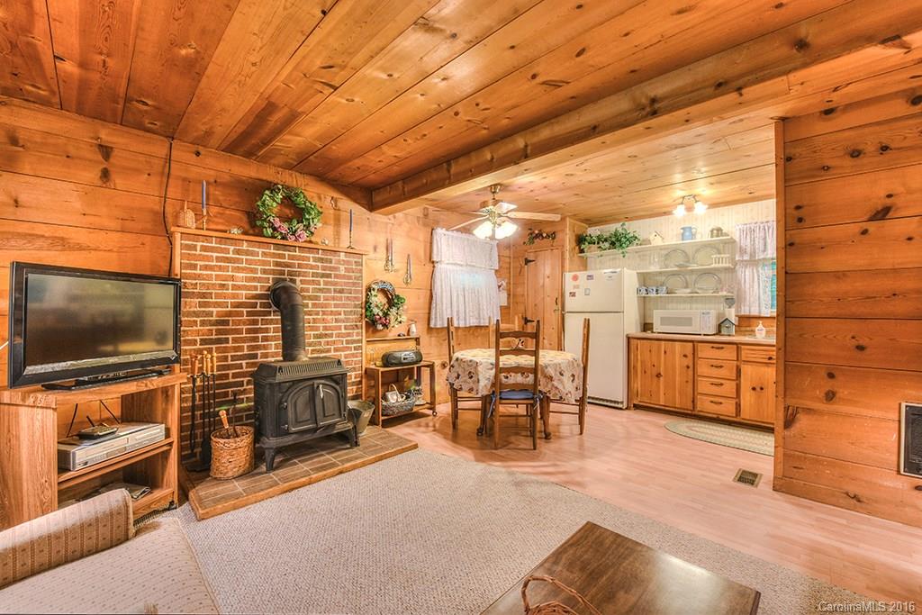 85 Miner Road Waynesville, NC 28785 - Photo 7 of 24 a dining room with furniture and a flat screen tv