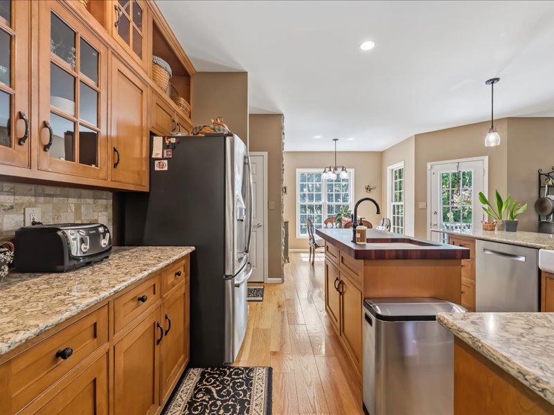 1168 Mt Pleasant Road Bangor, PA 18013 - Photo 29 of 100 Gleaming hardwood floors and stone countertops anchor this classic kitchen layout.