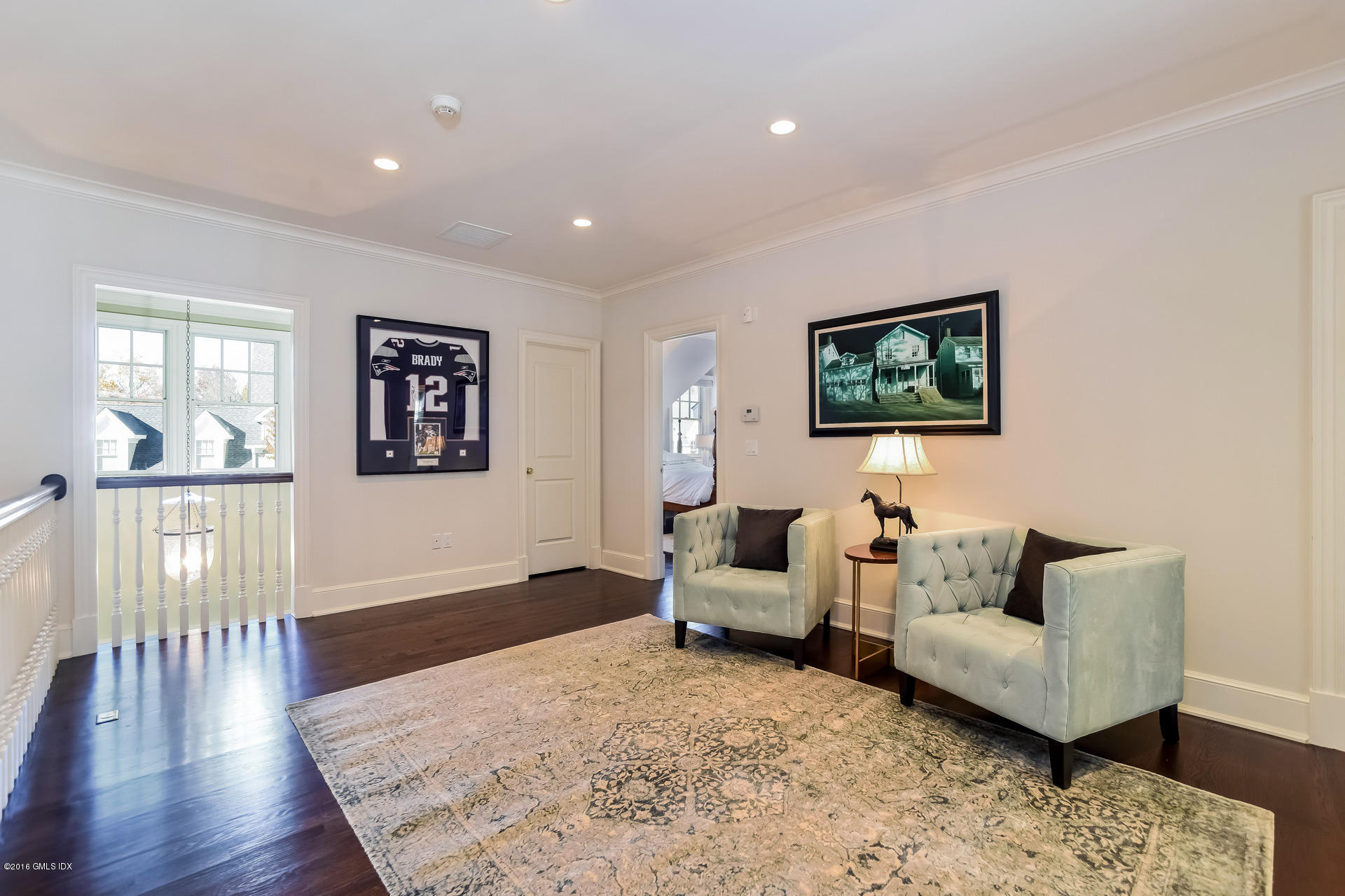 631 Long Ridge Road, Unit 57 Stamford, CT 06902 - Photo 18 of 29 a living room with furniture wooden floor and a flat screen tv