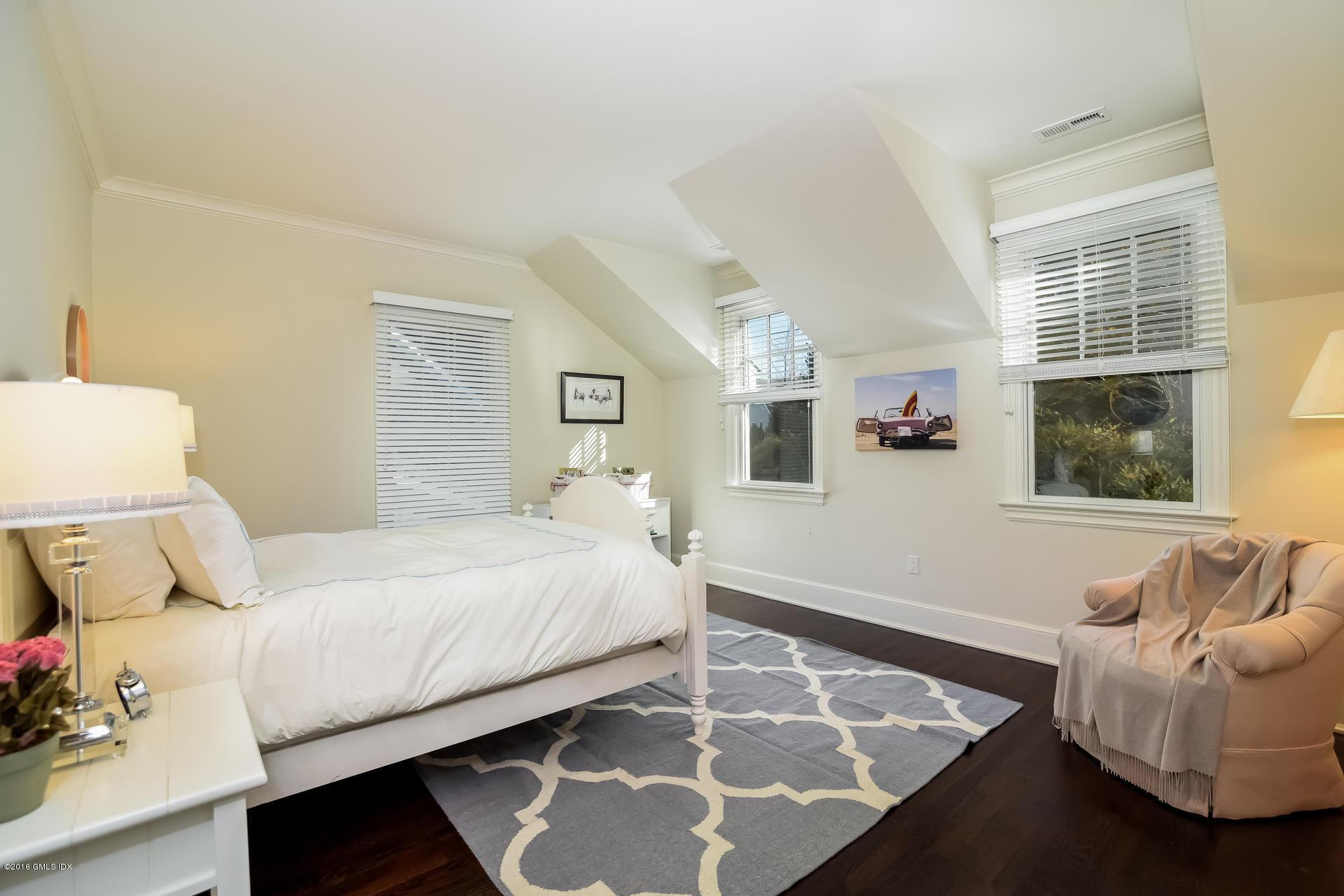 631 Long Ridge Road, Unit 57 Stamford, CT 06902 - Photo 22 of 29 a bedroom with a bed and wooden floor