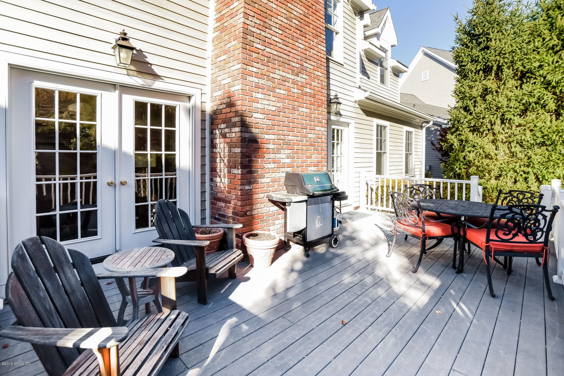 631 Long Ridge Road, Unit 57 Stamford, CT 06902 - Photo 23 of 29 a balcony with furniture and wooden floor