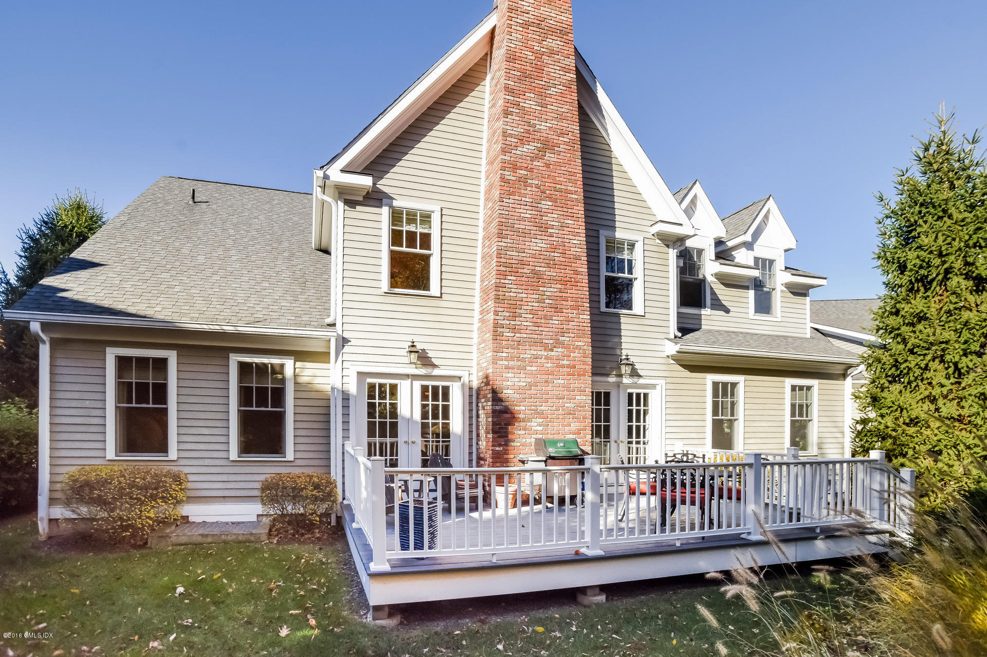 631 Long Ridge Road, Unit 57 Stamford, CT 06902 - Photo 24 of 29 a view of a house with a yard and deck