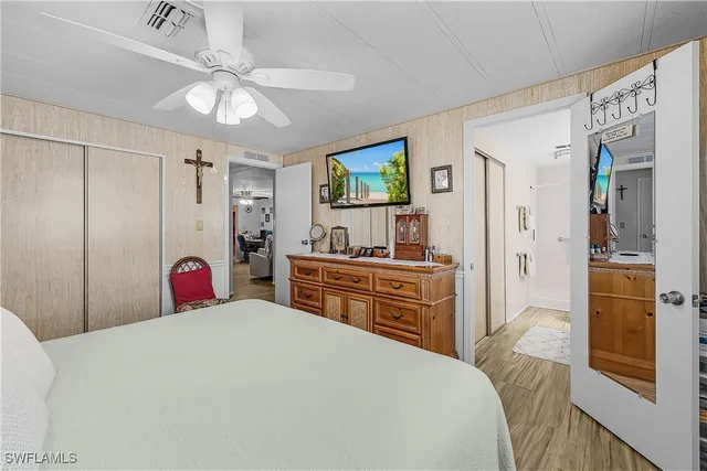 a bathroom with a sink a toilet a mirror and shower