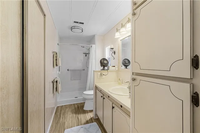 a bathroom with a sink toilet tub and shower