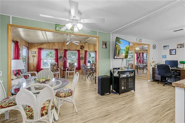 a view of a dining room with furniture and wooden floor