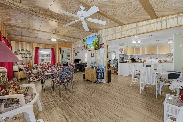 a view of a dining room with furniture and a chandelier
