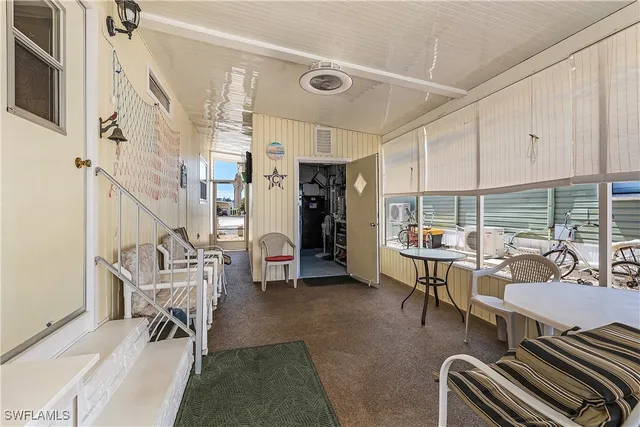 a front view of a house with a garden and plants